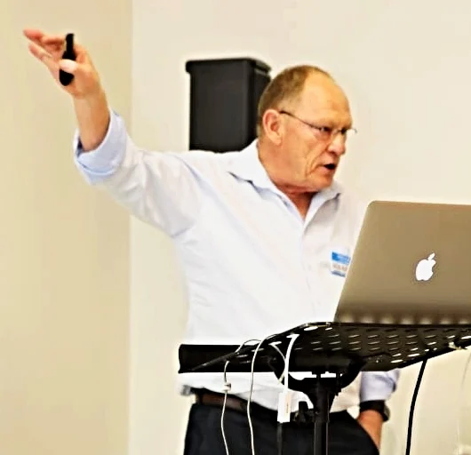 Dr Peter Thompson of BlueWing Local Marketing presenting at a business meeting.